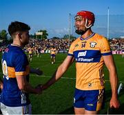 10 May 2025; Conor Stakelum of Tipperary and Peter Duggan of Clare shake hands after the Munster GAA Hurling Senior Championship Round 3 match between Clare and Tipperary at Zimmer Biomet Páirc Chíosóg in Ennis, Clare. Photo by Ray McManus/Sportsfile