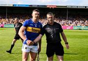 10 May 2025; Ronan Maher of Tipperary shakes hands with referee James Owens before the Munster GAA Hurling Senior Championship Round 3 match between Clare and Tipperary at Zimmer Biomet Páirc Chíosóg in Ennis, Clare. Photo by Ray McManus/Sportsfile