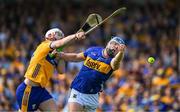 10 May 2025; Jason Forde of Tipperary in action against Conor Lean of Clare during the Munster GAA Hurling Senior Championship Round 3 match between Clare and Tipperary at Zimmer Biomet Páirc Chíosóg in Ennis, Clare. Photo by Ray McManus/Sportsfile