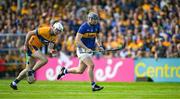 10 May 2025; Alan Tynan of Tipperary races clear of Cian Galvin of Clare during the Munster GAA Hurling Senior Championship Round 3 match between Clare and Tipperary at Zimmer Biomet Páirc Chíosóg in Ennis, Clare. Photo by Ray McManus/Sportsfile