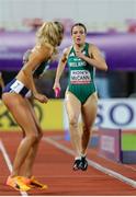 11 May 2025; Rachel McCann of Ireland, right, prepares to pass the baton to teammate Sharlene Mawdsley whilst competing in the women's 4x400m World Championship Qualifying Round 2 during day two of the 2025 World Athletics Relays at Guangdong Olympic Stadium in Guangzhou, China. Photo by Nikola Krstic/Sportsfile