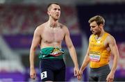 11 May 2025; Jack Raftery of Ireland, left, after competing in the men's 4x400m World Championship Qualifying Round 2 during day two of the 2025 World Athletics Relays at Guangdong Olympic Stadium in Guangzhou, China. Photo by Nikola Krstic/Sportsfile
