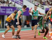 11 May 2025; Chris O'Donnell of Ireland, centre, passes the baton to teammate Jack Raftery whilst competing in the men's 4x400m World Championship Qualifying Round 2 during day two of the 2025 World Athletics Relays at Guangdong Olympic Stadium in Guangzhou, China. Photo by Nikola Krstic/Sportsfile
