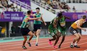 11 May 2025; Cillín Greene of Ireland, second from left, passes the baton to teammate Chris O'Donnell, left, whilst competing in the men's 4x400m World Championship Qualifying Round 2 during day two of the 2025 World Athletics Relays at Guangdong Olympic Stadium in Guangzhou, China. Photo by Nikola Krstic/Sportsfile