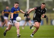 11 May 2025; Daithi Hogan of Tipperary in action against Brian Cox of Sligo during the Táilteann Cup match between Sligo and Tipperary at Kilcoyne Memorial Park in Tubbercurry, Sligo. Photo by Ray McManus/Sportsfile