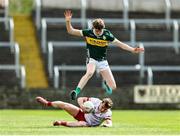 11 May 2025; Liam Óg Mossey of Tyrone is tackled by Killian Dennehy of Kerry during the Dalata Hotel Group GAA Football All-Ireland U20 Championship semi-final match between Kerry and Tyrone at Laois Hire O'Moore Park in Portlaoise, Laois. Photo by Thomas Flinkow/Sportsfile