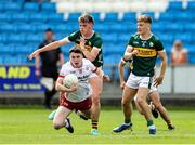 11 May 2025; Eoin McElholm of Tyrone in action against Kerry players Daniel Kirby, left, and Darragh O'Connor during the Dalata Hotel Group GAA Football All-Ireland U20 Championship semi-final match between Kerry and Tyrone at Laois Hire O'Moore Park in Portlaoise, Laois. Photo by Thomas Flinkow/Sportsfile