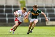 11 May 2025; Ruairí McCullagh of Tyrone in action against Aodhna Ó Beaglaoich of Kerry during the Dalata Hotel Group GAA Football All-Ireland U20 Championship semi-final match between Kerry and Tyrone at Laois Hire O'Moore Park in Portlaoise, Laois. Photo by Thomas Flinkow/Sportsfile