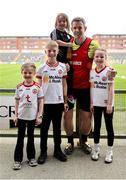 11 May 2025; Tyrone coach Cathal McCarron with family, from left, Molley, James, Maeve, and Kate, after his side's victory in the Dalata Hotel Group GAA Football All-Ireland U20 Championship semi-final match between Kerry and Tyrone at Laois Hire O'Moore Park in Portlaoise, Laois. Photo by Thomas Flinkow/Sportsfile
