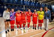 11 May 2025; Shelbourne players with members of their women's team Amanda McQuillan and Mackenzie Anthony, right, during the LOI Cairdeas Cup Festival match between / and / at the National Indoor Arena on the Sport Ireland Campus in Dublin. Photo by Stephen McCarthy/Sportsfile