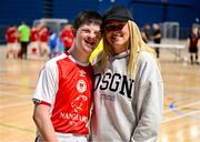 11 May 2025; Shelbourne's Amanda McQuillan with her brother Scott who played for St Patrick's Athletic during the LOI Cairdeas Cup Festival the National Indoor Arena on the Sport Ireland Campus in Dublin. Photo by Stephen McCarthy/Sportsfile