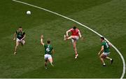 11 May 2025; Tommy Durnin of Louth kicks despite the attention of Meath players, from left, Eoghan Frayne, Seán Coffey and Donal Keogan during the Leinster GAA Football Senior Championship final match between Louth and Meath at Croke Park in Dublin. Photo by Ben McShane/Sportsfile