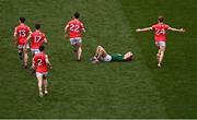 11 May 2025; Eoghan Frayne of Meath lays dejected at the final whistle as Louth players celebrate their victory in the Leinster GAA Football Senior Championship final match between Louth and Meath at Croke Park in Dublin. Photo by Ben McShane/Sportsfile