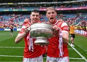 11 May 2025; Louth players Craig Lennon, left, and Ciarán Byrne celebrate with the Delaney Cup after their side's victory in the Leinster GAA Football Senior Championship final match between Louth and Meath at Croke Park in Dublin. Photo by Piaras Ó Mídheach/Sportsfile