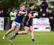 11 May 2025; Darragh Cummins of Sligo in action against Manus McFadden of Tipperary during the Táilteann Cup match between Sligo and Tipperary at Kilcoyne Memorial Park in Tubbercurry, Sligo. Photo by Ray McManus/Sportsfile