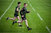 11 May 2025; Injured Sligo players Luke Casserly, right, and Eoghan Smith run lengths before the Táilteann Cup match between Sligo and Tipperary at Kilcoyne Memorial Park in Tubbercurry, Sligo. Photo by Ray McManus/Sportsfile