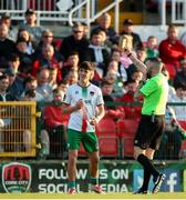 9 May 2025; Matthew Kiernan of Cork City is shown a yellow card by referee Declan Toland  during the SSE Airtricity Men's Premier Division match between Cork City and Derry City at Turner's Cross in Cork. Photo by Michael P Ryan/Sportsfile