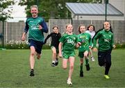 12 May 2025; Olympian Thomas Barr with students from St Laurence's Catholic National School during the Dare to Believe Olympic Schools Programme at St Laurence's Catholic National School in Kildare. Photo by David Fitzgerald/Sportsfile