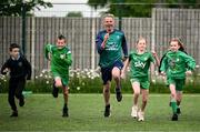12 May 2025; Olympian Thomas Barr with students from St Laurence's Catholic National School during the Dare to Believe Olympic Schools Programme at St Laurence's Catholic National School in Kildare. Photo by David Fitzgerald/Sportsfile