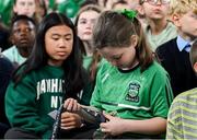 12 May 2025; Students from St Laurence's Catholic National School look at Olympian Thomas Barr's medals during the Dare to Believe Olympic Schools Programme at St Laurence's Catholic National School in Kildare. Photo by David Fitzgerald/Sportsfile