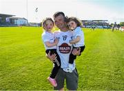 10 May 2025; Kildare supporter Ray Hyland, from Athy, Co Kildare, brother of Kildare player David, with his daughters Katelyn, right, aged 1, and Caoimhe, aged 3, on the pitch at halftime during the Táilteann Cup Round 1 match between Kildare and Leitrim at Cedral St Conleth's Park in Newbridge, Kildare. Photo by Daire Brennan/Sportsfile