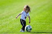 10 May 2025; Kildare supporter Katelyn Hyland, aged 1, from Athy, Co Kildare, niece of Kildare player David Hyland, plays on the pitch at halftime during the Táilteann Cup Round 1 match between Kildare and Leitrim at Cedral St Conleth's Park in Newbridge, Kildare. Photo by Daire Brennan/Sportsfile