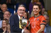 10 May 2025; Armagh captain Clodagh McCambridge is presented with the trophy by Ulster LGFA President Gerry Doherty after the TG4 Ulster LGFA Senior Football Championship final match between Armagh and Donegal at St Tiernach's Park in Clones, Monaghan. Photo by Ramsey Cardy/Sportsfile