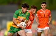 10 May 2025; Dáire Ó Baoill of Donegal in action against Jason Duffy of Armagh during the Ulster GAA Football Senior Championship final match between Armagh and Donegal at St Tiernach's Park in Clones, Monaghan. Photo by Ramsey Cardy/Sportsfile