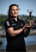 13 May 2025; PwC GPA Player of the Month for April in camogie, Mairéad Teehan of Offaly, with her award outside the PwC offices in Cork. Photo by David Fitzgerald/Sportsfile