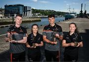 13 May 2025; PwC GAA/GPA Player of the Month for April Cork hurler Brian Hayes, Meath footballer Mathew Costello, left, and PwC GPA Women Players of the Month for April, Kerry ladies footballer Síofra O’Shea, right, and Offaly camogie player Mairéad Teehan with their awards at PwC offices in Cork today. Photo by David Fitzgerald/Sportsfile