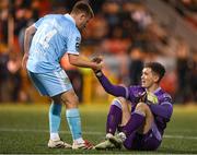 5 May 2025; Derry City goalkeeper Brian Maher is helped up by Brandon Kavanagh of St Patrick's Athletic during the SSE Airtricity Men's Premier Division match between Derry City and St Patrick's Athletic at The Ryan McBride Brandywell Stadium in Derry. Photo by Stephen McCarthy/Sportsfile
