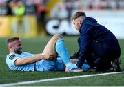 5 May 2025; Ryan McLaughlin of St Patrick's Athletic receives medical attention from St Patrick's Athletic head of medical Sam Rice during the SSE Airtricity Men's Premier Division match between Derry City and St Patrick's Athletic at The Ryan McBride Brandywell Stadium in Derry. Photo by Stephen McCarthy/Sportsfile