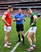 11 May 2025; Referee Martin McNally with team captains Sam Mulroy of Louth and Eoghan Frayne of Meath before the Leinster GAA Football Senior Championship final match between Louth and Meath at Croke Park in Dublin. Photo by Piaras Ó Mídheach/Sportsfile