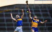 14 May 2025; Adam Ryan of Tipperary in action against James Organ of Clare during the oneills.com Munster GAA Hurling U20 Championship final match between Tipperary and Clare at TUS Gaelic Grounds in Limerick. Photo by Tyler Miller/Sportsfile