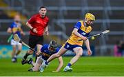 14 May 2025; Daniel Costelloe of Clare evades the tackle of Adam Daly of Tipperary during the oneills.com Munster GAA Hurling U20 Championship final match between Tipperary and Clare at TUS Gaelic Grounds in Limerick. Photo by Tyler Miller/Sportsfile
