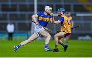 14 May 2025; Adam Ryan of Tipperary in action against Sean Boyce of Clare during the oneills.com Munster GAA Hurling U20 Championship final match between Tipperary and Clare at TUS Gaelic Grounds in Limerick. Photo by Tyler Miller/Sportsfile