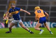 14 May 2025; Conor Martin of Tipperary in action against Daniel Costelloe of Clare during the oneills.com Munster GAA Hurling U20 Championship final match between Tipperary and Clare at TUS Gaelic Grounds in Limerick. Photo by John Sheridan/Sportsfile