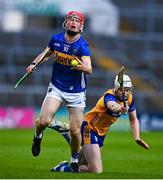 14 May 2025; Cathal English of Tipperary in action against Eoin McMahon of Clare during the oneills.com Munster GAA Hurling U20 Championship final match between Tipperary and Clare at TUS Gaelic Grounds in Limerick. Photo by Tyler Miller/Sportsfile