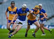 14 May 2025; Oisin O'Donoghue of Tipperary in action against Eoghan Gunning of Clare during the oneills.com Munster GAA Hurling U20 Championship final match between Tipperary and Clare at TUS Gaelic Grounds in Limerick. Photo by Tyler Miller/Sportsfile