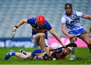 14 May 2025; Cathal English of Tipperary kicks to score his side's third goal despite the efforts of Eoin McMahon of Clare during the oneills.com Munster GAA Hurling U20 Championship final match between Tipperary and Clare at TUS Gaelic Grounds in Limerick. Photo by Tyler Miller/Sportsfile