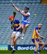 14 May 2025; Cathal English of Tipperary in action against Clare goalkeeper Mark Sheedy during the oneills.com Munster GAA Hurling U20 Championship final match between Tipperary and Clare at TUS Gaelic Grounds in Limerick. Photo by Tyler Miller/Sportsfile