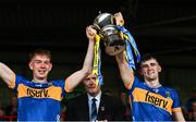 14 May 2025; Tipperary joint captains Paddy McCormack, left, and Sam O'Farrell lift the cup after the oneills.com Munster GAA Hurling U20 Championship final match between Tipperary and Clare at TUS Gaelic Grounds in Limerick. Photo by Tyler Miller/Sportsfile