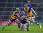 14 May 2025; Aaron O'Halloran of Tipperary is tackled by Clare players, from left, James Hegarty and Jack O'Neill during the oneills.com Munster GAA Hurling U20 Championship final match between Tipperary and Clare at TUS Gaelic Grounds in Limerick. Photo by John Sheridan/Sportsfile