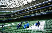 3 May 2025; Members of teh OLSC set put flags in the seats before the Investec Champions Cup semi-final match between Leinster and Northampton Saints at the Aviva Stadium in Dublin. Photo by Brendan Moran/Sportsfile