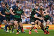 3 May 2025; Jordie Barrett of Leinster is tackled by Henry Pollock and Rory Hutchinson of Northampton Saints during the Investec Champions Cup semi-final match between Leinster and Northampton Saints at the Aviva Stadium in Dublin. Photo by Brendan Moran/Sportsfile