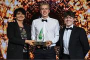 15 May 2025; UCD Men’s Basketball Varsity 1st Team captain Thomas Reynolds, centre, and coach Murray Baker are presented with the Varsity Team of the Year award by University College Dublin president Professor Orla Feely during the UCD Athletic Union Council Sports Awards 2025 at Astra Hall in UCD, Dublin. Photo by Seb Daly/Sportsfile