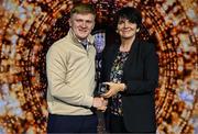 15 May 2025; Cathal Murphy is presented with the Dr Padraic Conway Memorial Medal by University College Dublin president Professor Orla Feely during the UCD Athletic Union Council Sports Awards 2025 at Astra Hall in UCD, Dublin. Photo by Seb Daly/Sportsfile