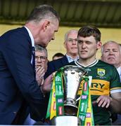 4 May 2025; Kerry captain Gavin White winks as he is presented with the cup by Munster Council chairman Tim Murphy after the Munster GAA Football Senior Championship final match between Kerry and Clare at Fitzgerald Stadium in Killarney, Kerry. Photo by Brendan Moran/Sportsfile