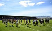 4 May 2025; The Kerry and Clare teams during the parade before the Munster GAA Football Senior Championship final match between Kerry and Clare at Fitzgerald Stadium in Killarney, Kerry. Photo by Brendan Moran/Sportsfile