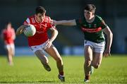 16 May 2025; Tadhg McDonnell of Louth in action against Cathal Keaveney of Mayo during the Dalata Hotel Group GAA Football All-Ireland U20 Championship semi-final match between Mayo and Louth at Glennon Brothers Pearse Park in Longford. Photo by Stephen Marken/Sportsfile